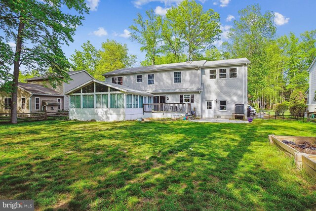 813 Petinot Pl, Stevensville, MD 21666 - rear view of house featuring a sunroom and a patio area