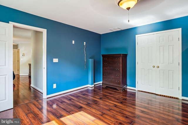 813 Petinot Pl, Stevensville, MD 21666 - unfurnished bedroom featuring hardwood / wood-style flooring, a closet, and baseboards