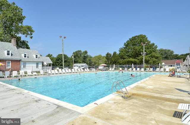 813 Petinot Pl, Stevensville, MD 21666 - community pool featuring a patio area and view of scattered trees