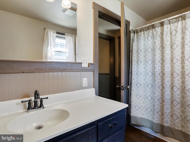 2297 Big Cove Tannery Rd, Big Cove Tannery, PA 17212 - full bathroom featuring wainscoting, vanity, and a shower with curtain
