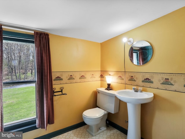 2297 Big Cove Tannery Rd, Big Cove Tannery, PA 17212 - bathroom with a wealth of natural light, tile patterned floors, a sink, and toilet