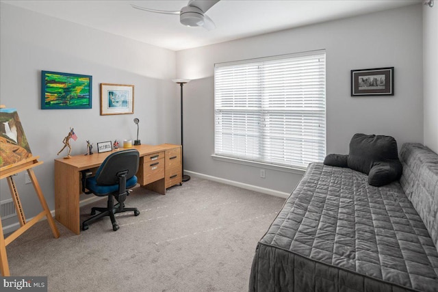 carpeted bedroom with baseboards, a ceiling fan, and multiple windows