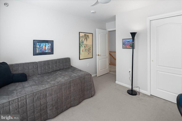 bedroom with carpet flooring and baseboards