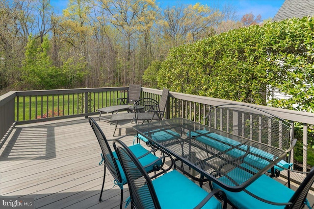 deck featuring outdoor dining area