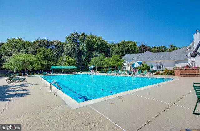 pool with a patio