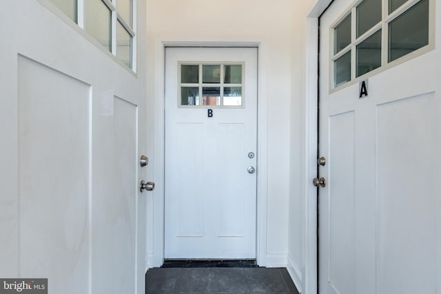 doorway to property with stucco siding
