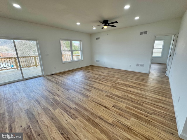 531 E High St, Bellefonte, PA 16823 - unfurnished living room featuring wood finished floors, visible vents, baseboards, and ceiling fan