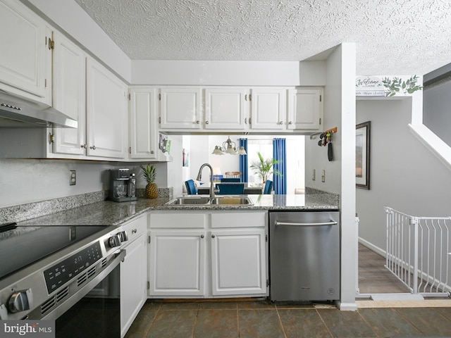 8554 Koluder Ct, Lorton, VA 22079 - kitchen with stainless steel appliances, a sink, white cabinetry, and a textured ceiling