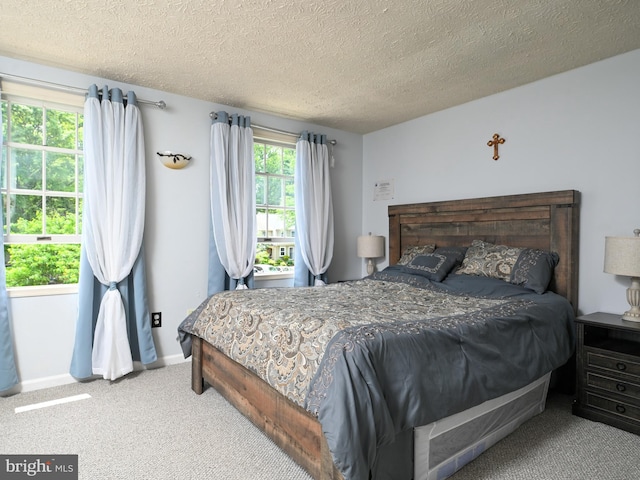 8554 Koluder Ct, Lorton, VA 22079 - carpeted bedroom with a textured ceiling and baseboards