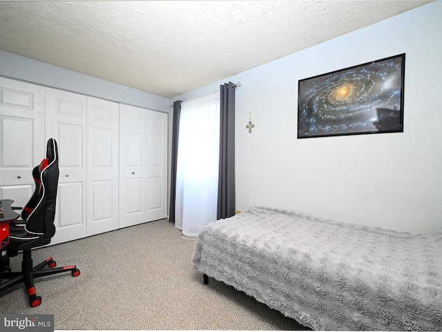 8554 Koluder Ct, Lorton, VA 22079 - carpeted bedroom with a closet and a textured ceiling