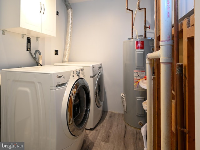 8554 Koluder Ct, Lorton, VA 22079 - laundry area featuring electric water heater, washer and dryer, cabinet space, and wood finished floors