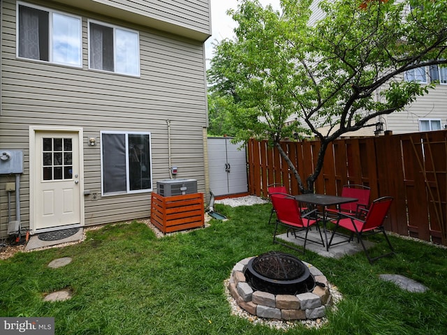 8554 Koluder Ct, Lorton, VA 22079 - view of yard with an outdoor fire pit, cooling unit, and a patio