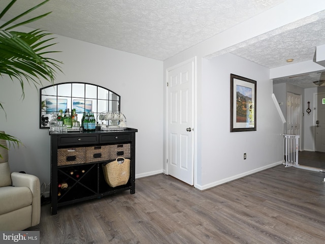 8554 Koluder Ct, Lorton, VA 22079 - sitting room featuring wood finished floors, a textured ceiling, and baseboards