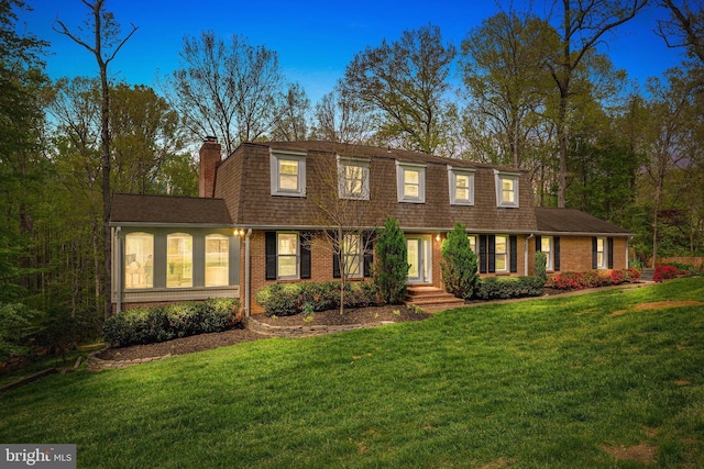 1004 Union Church Rd, Mclean, VA 22102 - view of front of home featuring a front lawn, a chimney, roof with shingles, and brick siding