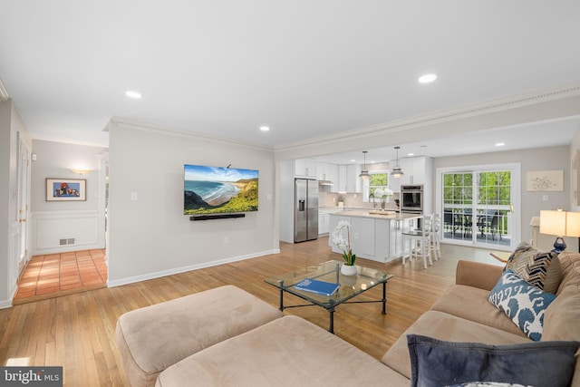 1004 Union Church Rd, Mclean, VA 22102 - living room with crown molding, light wood-style flooring, visible vents, baseboards, and recessed lighting