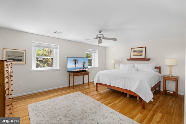 1004 Union Church Rd, Mclean, VA 22102 - bedroom with baseboards, visible vents, wood finished floors, and multiple windows
