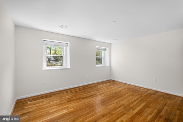 1004 Union Church Rd, Mclean, VA 22102 - empty room with baseboards, visible vents, a wealth of natural light, and light wood-style floors