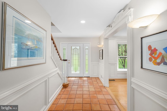1004 Union Church Rd, Mclean, VA 22102 - foyer featuring recessed lighting, light wood-type flooring, a wainscoted wall, stairs, and a decorative wall