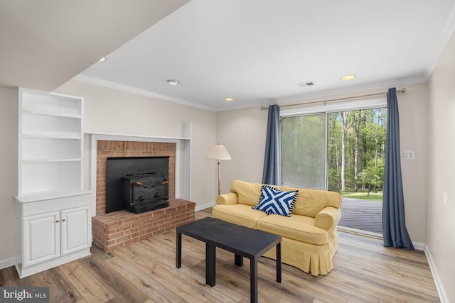 1004 Union Church Rd, Mclean, VA 22102 - living room featuring a wood stove, visible vents, baseboards, ornamental molding, and light wood finished floors
