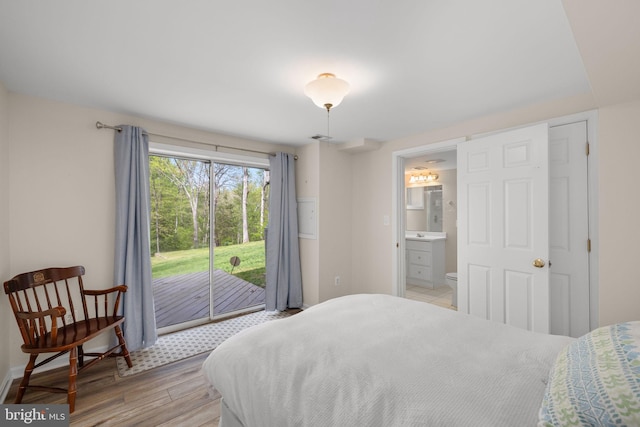 1004 Union Church Rd, Mclean, VA 22102 - bedroom with baseboards, ensuite bath, access to outside, and light wood-type flooring