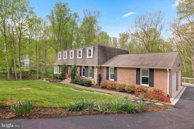 1004 Union Church Rd, Mclean, VA 22102 - view of property with a front yard, a garage, brick siding, driveway, and roof with shingles