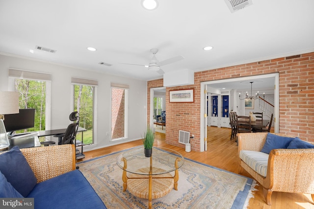 1004 Union Church Rd, Mclean, VA 22102 - living room with visible vents, wood finished floors, and brick wall