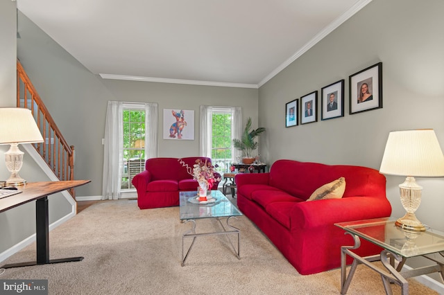 carpeted living room with stairs, ornamental molding, and baseboards