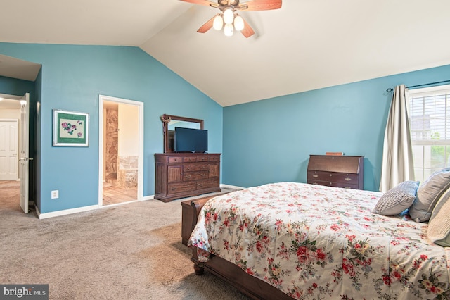 bedroom with vaulted ceiling, carpet flooring, baseboards, a ceiling fan, and connected bathroom