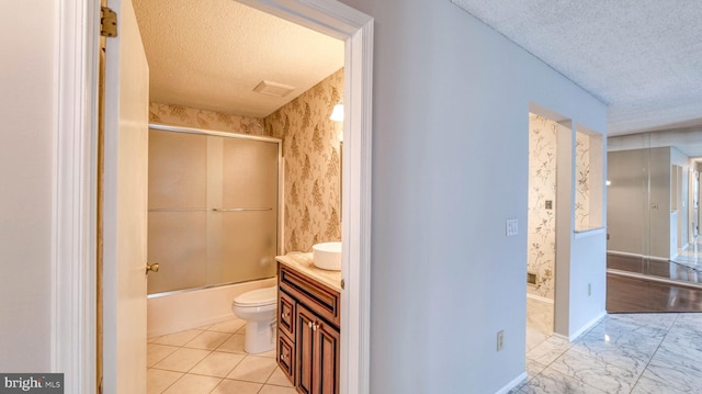 68 Arapaho Pl, Galloway, NJ 08205 - full bathroom with wallpapered walls, enclosed tub / shower combo, toilet, vanity, and a textured ceiling