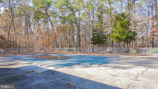 68 Arapaho Pl, Galloway, NJ 08205 - community pool with fence, a wooded view, and a patio