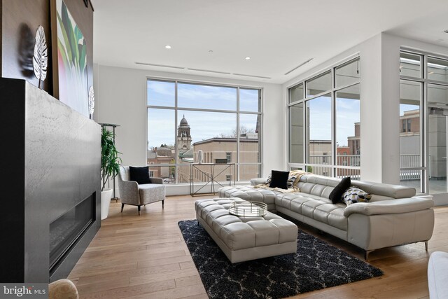 101 N Queen St Unit 402, Lancaster, PA 17603 - living room with light wood finished floors and floor to ceiling windows
