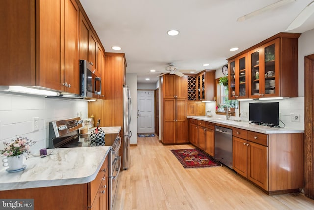 9 Still Run Dr, Mickleton, NJ 08056 - kitchen with brown cabinets, a sink, stainless steel appliances, recessed lighting, and light wood-type flooring