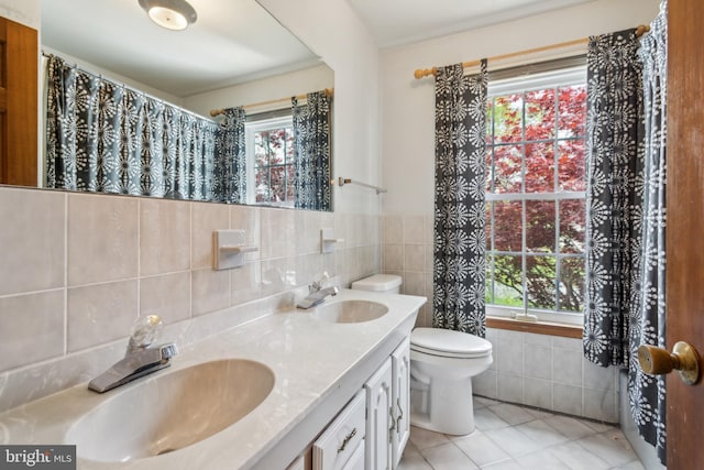9 Still Run Dr, Mickleton, NJ 08056 - full bathroom featuring a sink, tile walls, tile patterned floors, and a healthy amount of sunlight