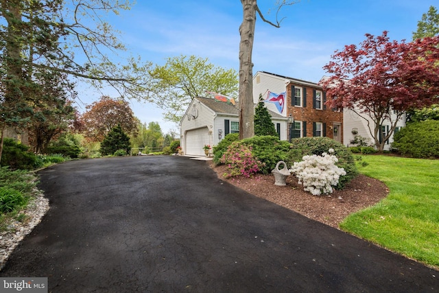 9 Still Run Dr, Mickleton, NJ 08056 - view of front facade featuring brick siding, driveway, a front yard, and a garage