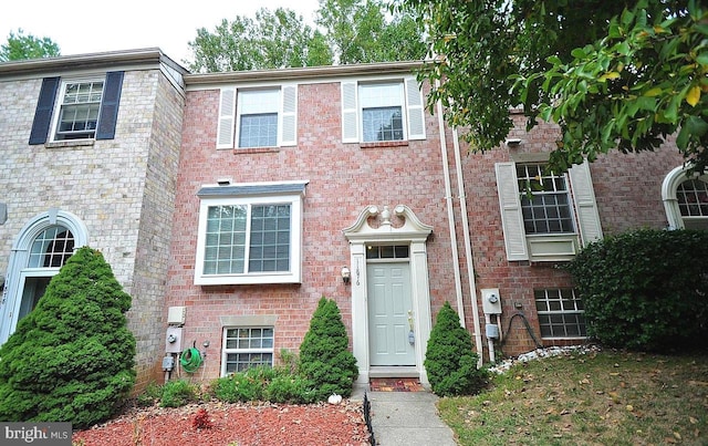 view of front of home with brick siding