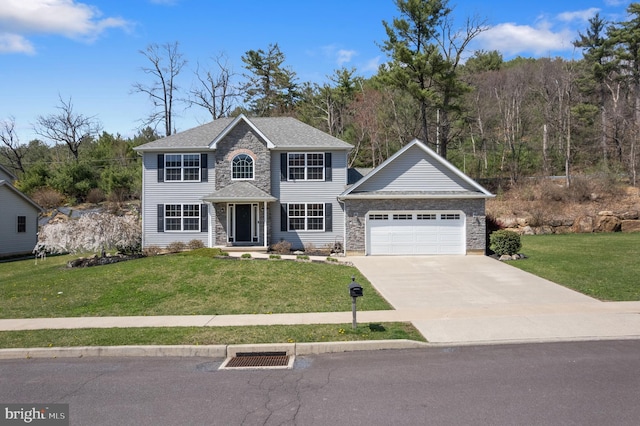 colonial house with a front lawn, driveway, stone siding, and a garage