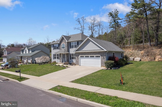 view of front of property with an attached garage, driveway, a front lawn, and stone siding