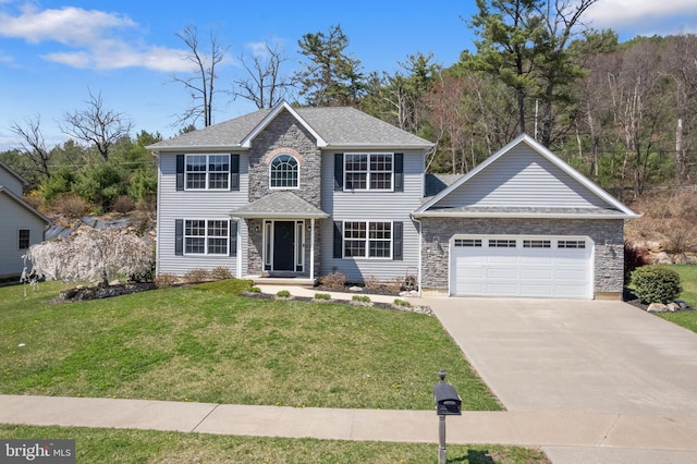 colonial home with concrete driveway, an attached garage, stone siding, roof with shingles, and a front yard