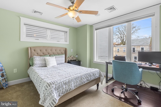 bedroom with baseboards, a ceiling fan, visible vents, and carpet flooring