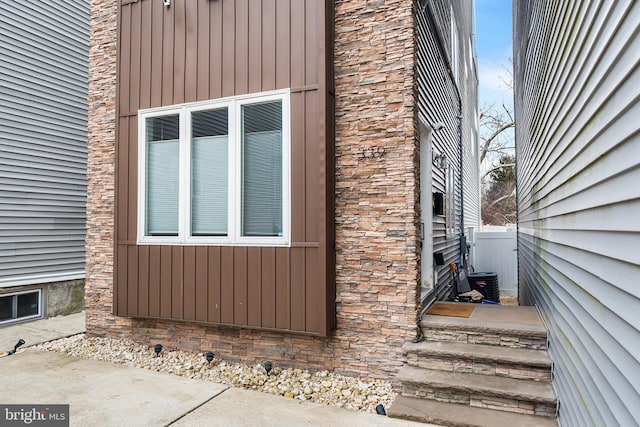 view of home's exterior featuring fence