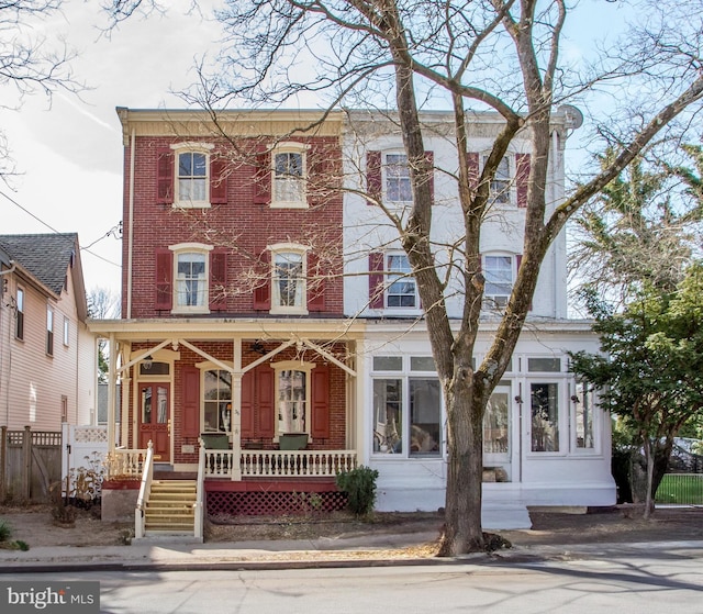 36 S Clinton St, Doylestown, PA 18901 - multi unit property with fence, covered porch, and brick siding