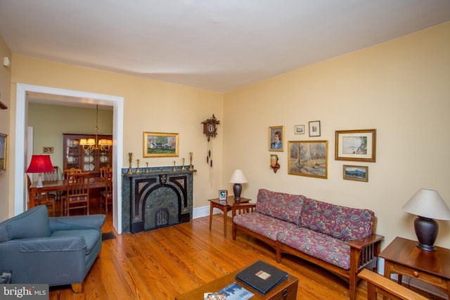 36 S Clinton St, Doylestown, PA 18901 - living area with an inviting chandelier, wood finished floors, and baseboards