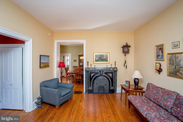 36 S Clinton St, Doylestown, PA 18901 - living room with a fireplace with flush hearth, wood finished floors, and baseboards