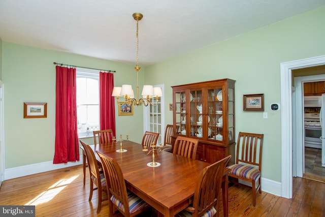 36 S Clinton St, Doylestown, PA 18901 - dining area featuring wood-type flooring, a chandelier, and baseboards