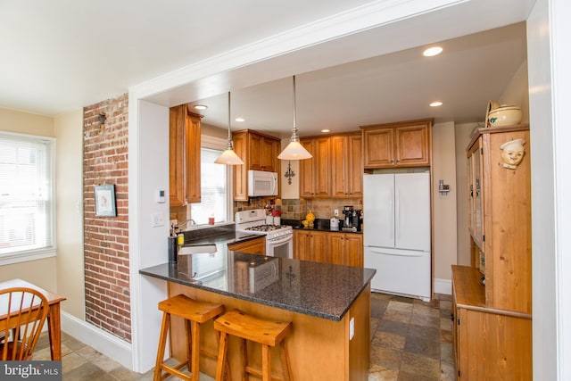36 S Clinton St, Doylestown, PA 18901 - kitchen featuring white appliances, brown cabinetry, tasteful backsplash, a peninsula, and baseboards