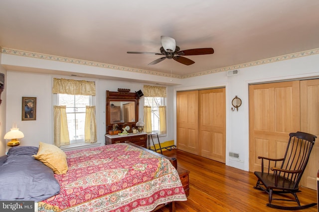 36 S Clinton St, Doylestown, PA 18901 - bedroom with visible vents, multiple windows, wood finished floors, and two closets