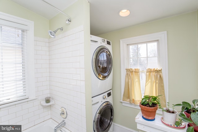 36 S Clinton St, Doylestown, PA 18901 - washroom featuring stacked washer and clothes dryer, laundry area, and baseboards