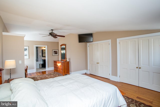 36 S Clinton St, Doylestown, PA 18901 - bedroom with a ceiling fan, two closets, vaulted ceiling, and wood finished floors