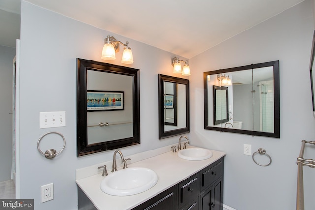 36 S Clinton St, Doylestown, PA 18901 - full bathroom with double vanity, vaulted ceiling, and a sink