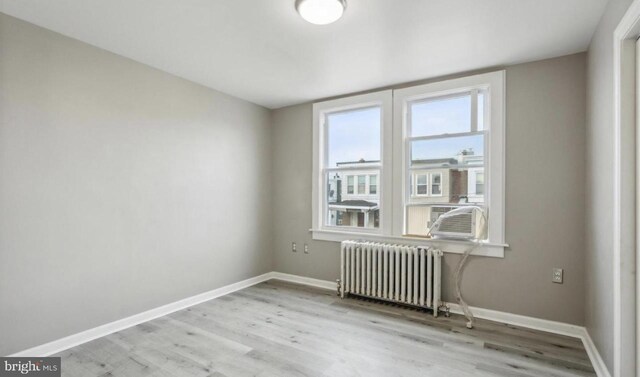 5915 Palmetto St, Philadelphia, PA 19120 - spare room featuring radiator, baseboards, and wood finished floors